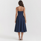 Navy blue A-line dress back view, spaghetti straps, pleated flared skirt