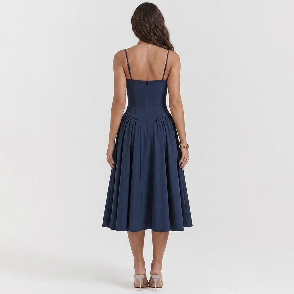Navy blue A-line dress back view, spaghetti straps, pleated flared skirt