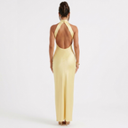 Yellow satin halter neck maxi dress with open back, sleeveless design
