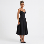 Black corset midi dress with spaghetti straps and fitted bodice, knee-to-mid calf length