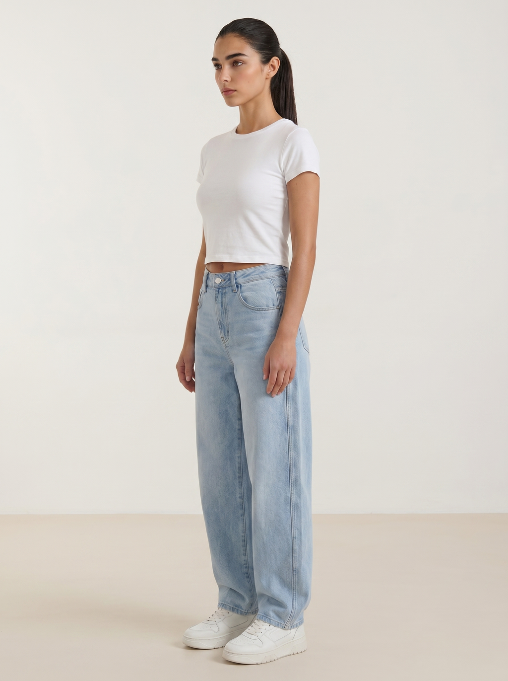 Light blue wide-leg jeans with button fly and straight, roomy legs