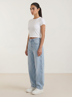 Light blue wide-leg jeans with button fly and straight, roomy legs