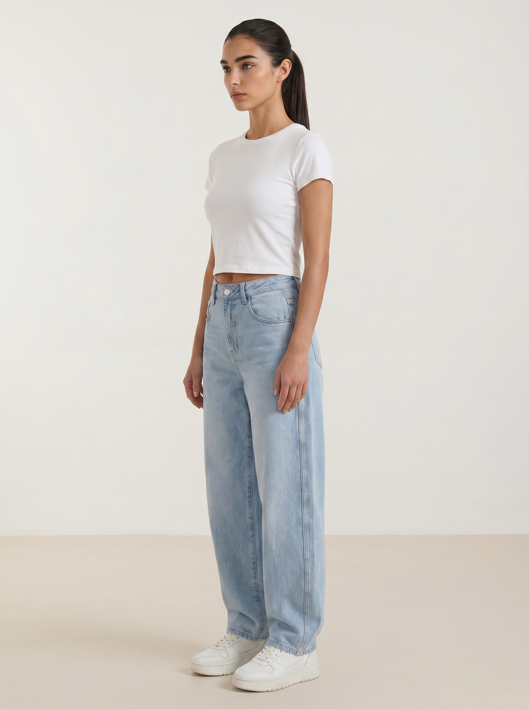 Light blue wide-leg jeans with button fly and straight, roomy legs