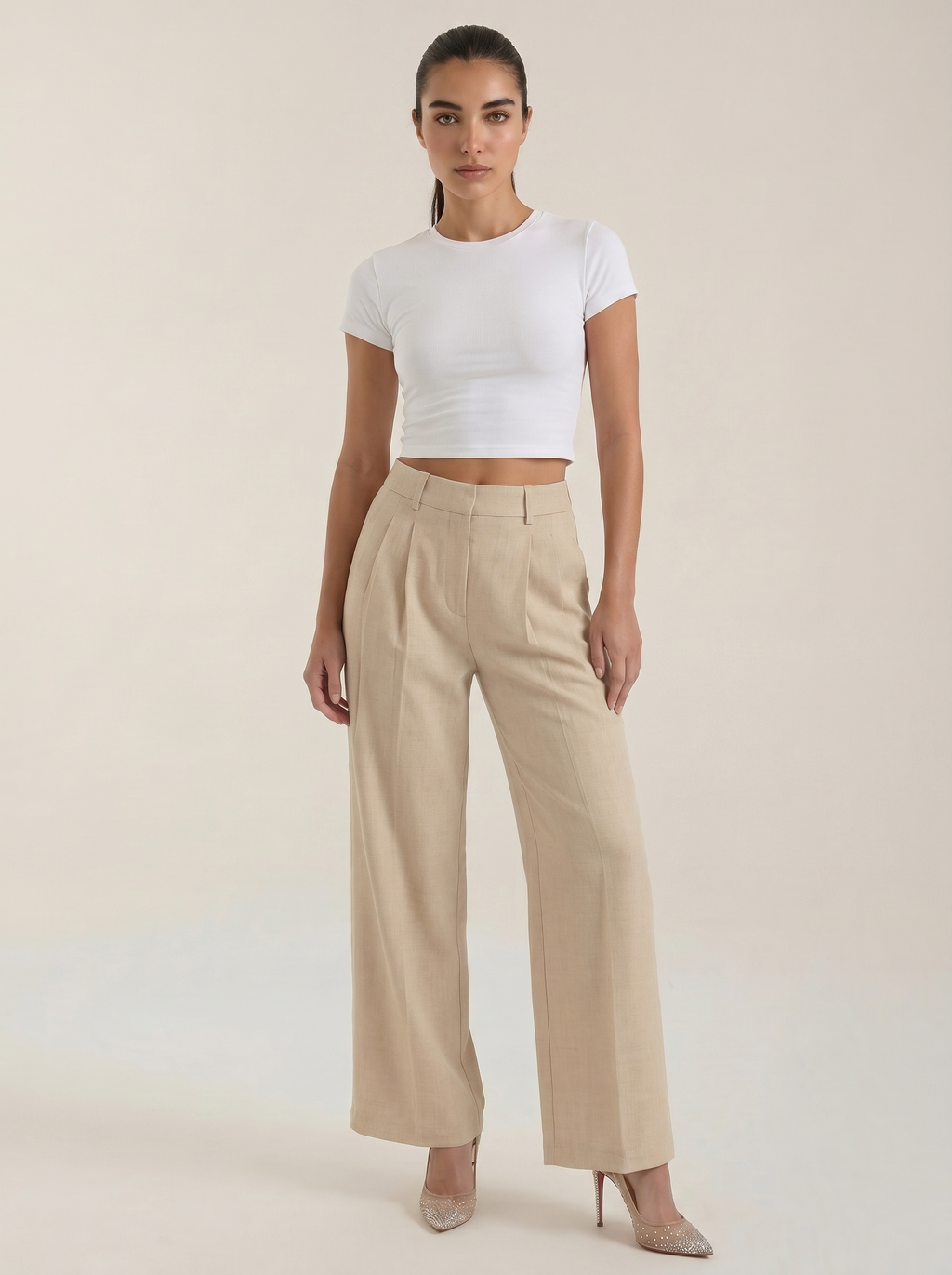 Pleated high-rise wide-leg pants in beige, with front pleats and straight wide legs