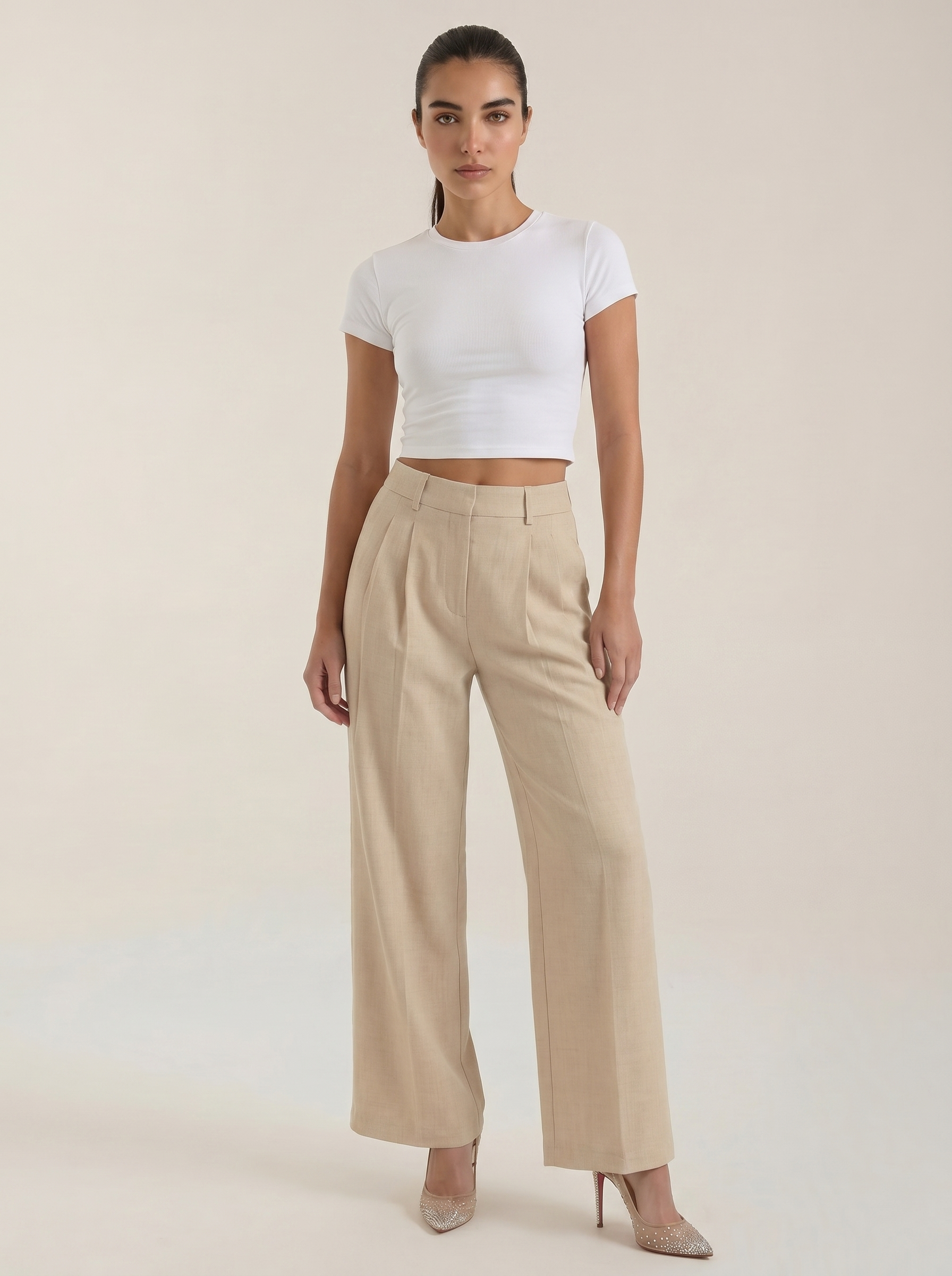Pleated high-rise wide-leg pants in beige, with front pleats and straight wide legs