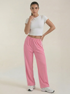 Pink wide-leg track pants with elastic waist, drawstring, and side stripe