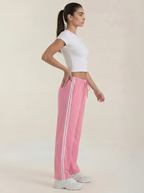 Pink wide-leg track pants, side view, elastic waist and drawstring with stripe
