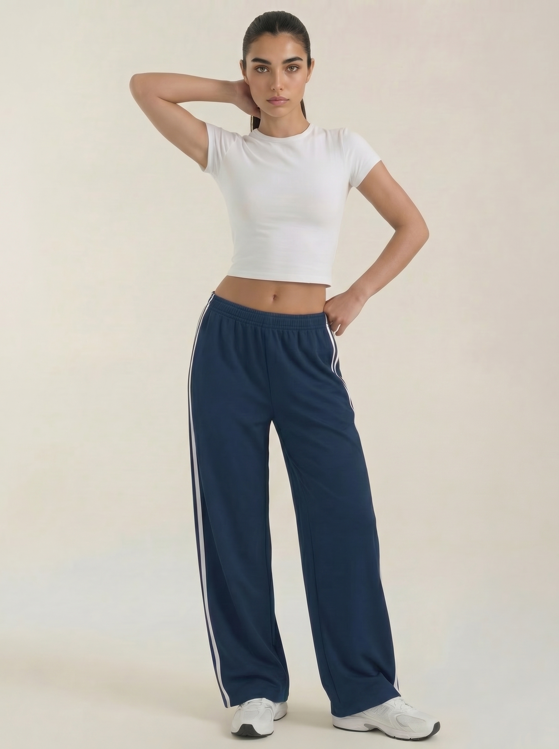 Women’s wide leg track pants in dark blue with white side stripes, drawstring waist