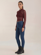 Sheer wrap mesh top in burgundy with draped wrap neckline and sheer long sleeves