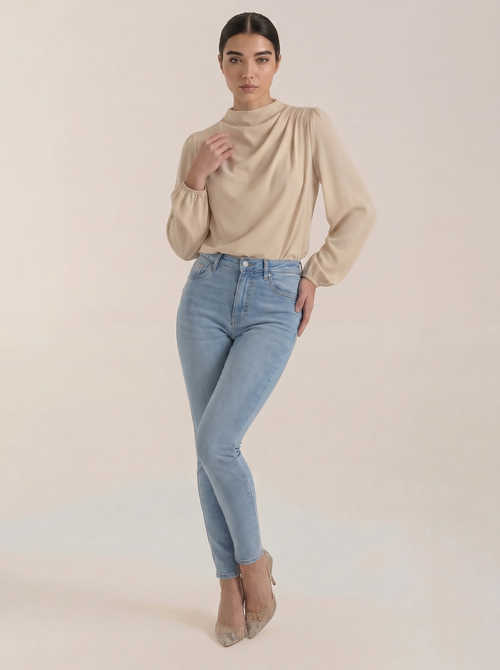Beige draped long-sleeve blouse with cowl neckline and gathered shoulders