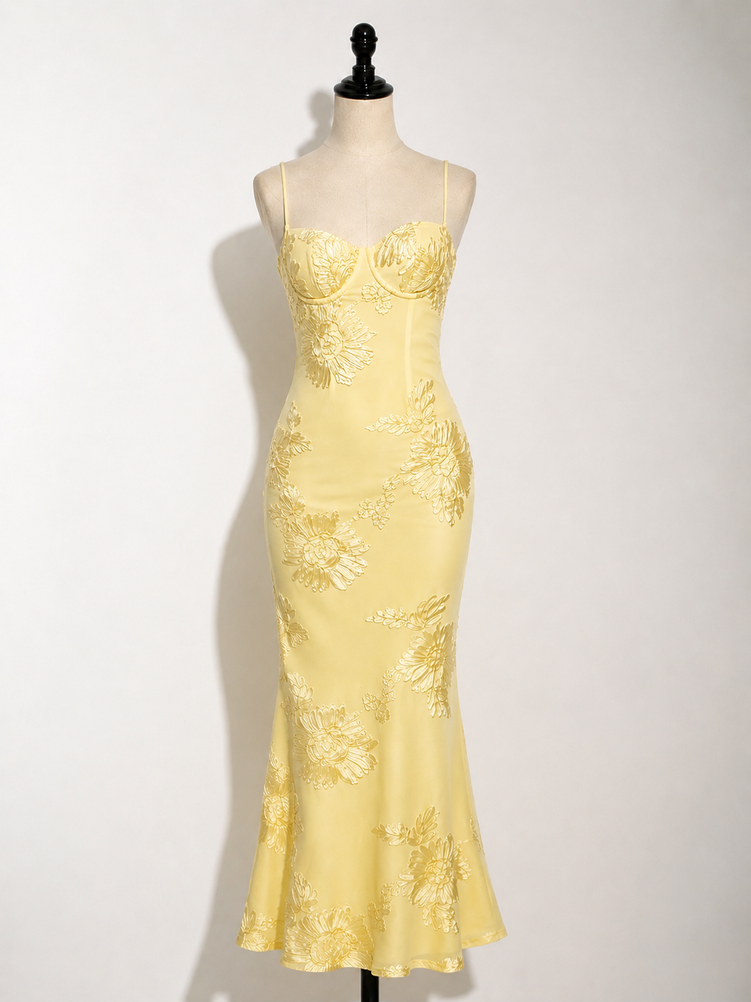 Yellow floral jacquard maxi dress on mannequin, corset-style bodice, spaghetti straps