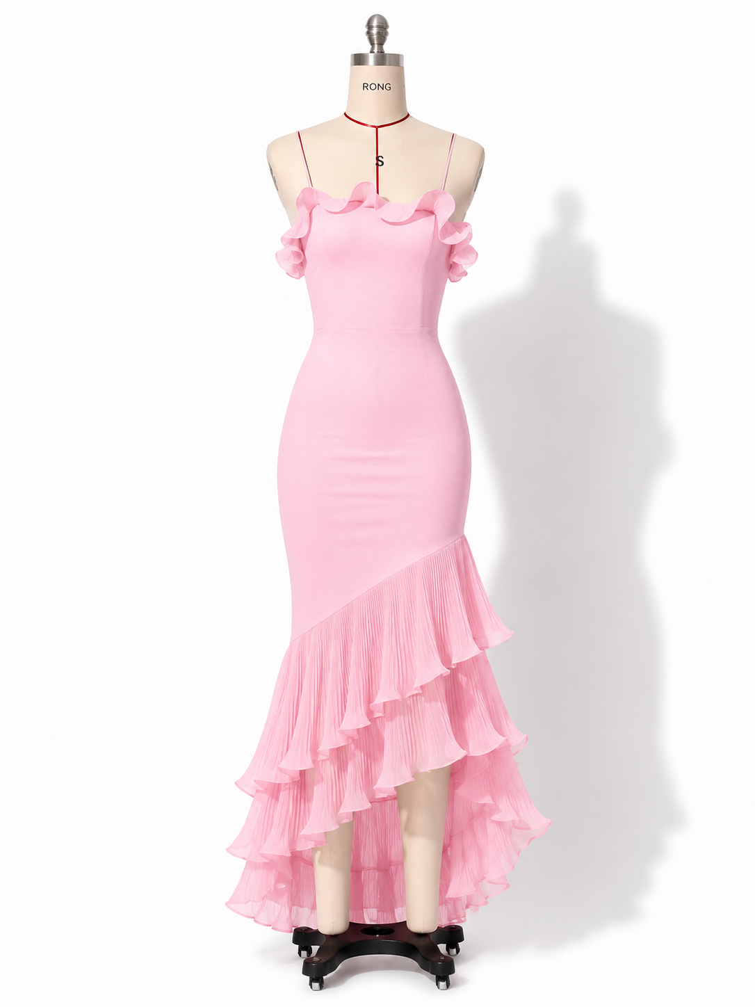 Pink ruffled maxi dress on mannequin with thin straps and tiered ruffle hem