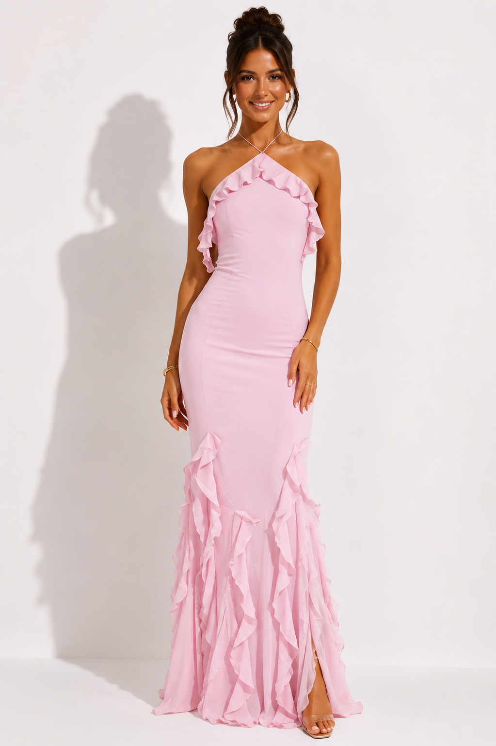 Pink halter-neck maxi dress with ruffled neckline and cascading ruffle hem