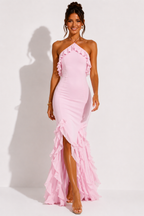 Pink halter-neck maxi dress with cascading ruffles along the skirt and long hem