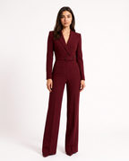 Burgundy V-neck blazer jumpsuit with waist belt and wide-leg trousers