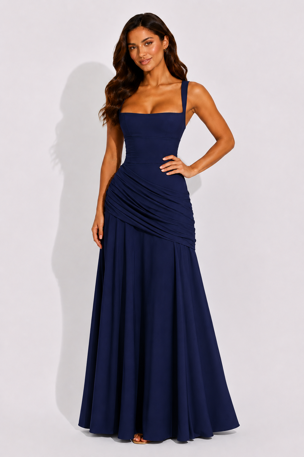 Navy maxi dress with square neckline and ruched draped waist, sleeveless, long skirt.