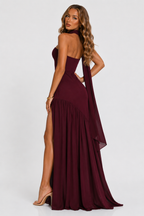 Burgundy strapless maxi dress with pleated skirt and high side slit, back view