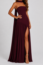 Burgundy strapless maxi dress with pleated skirt and high side slit, front view