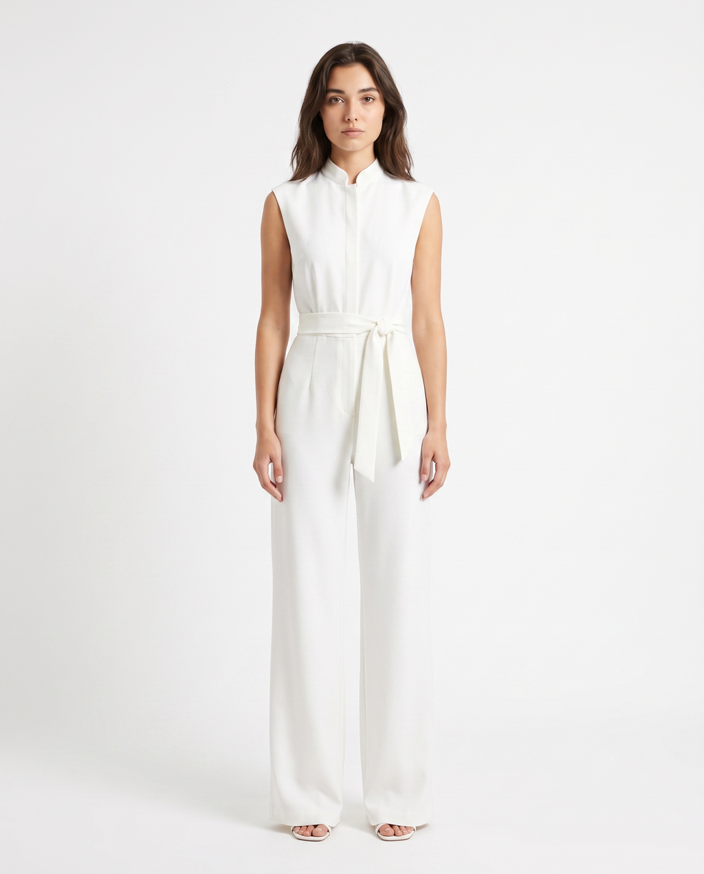 White sleeveless wide-leg jumpsuit with tie-waist sash and high neckline, full length