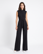 Black sleeveless wide-leg jumpsuit with zip-front and tie-waist belt, front view
